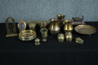 A collection of various brass items including a picture frame, trinket boxes and a wine holder. H.20