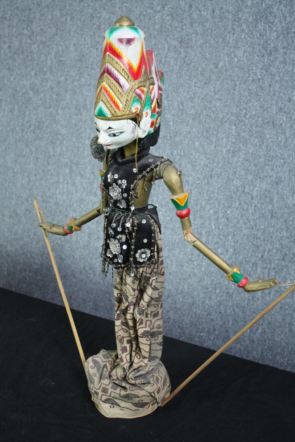 A vintage Indonesian carved and painted puppet. With a well decorated headdress and fabric dress. - Image 2 of 5