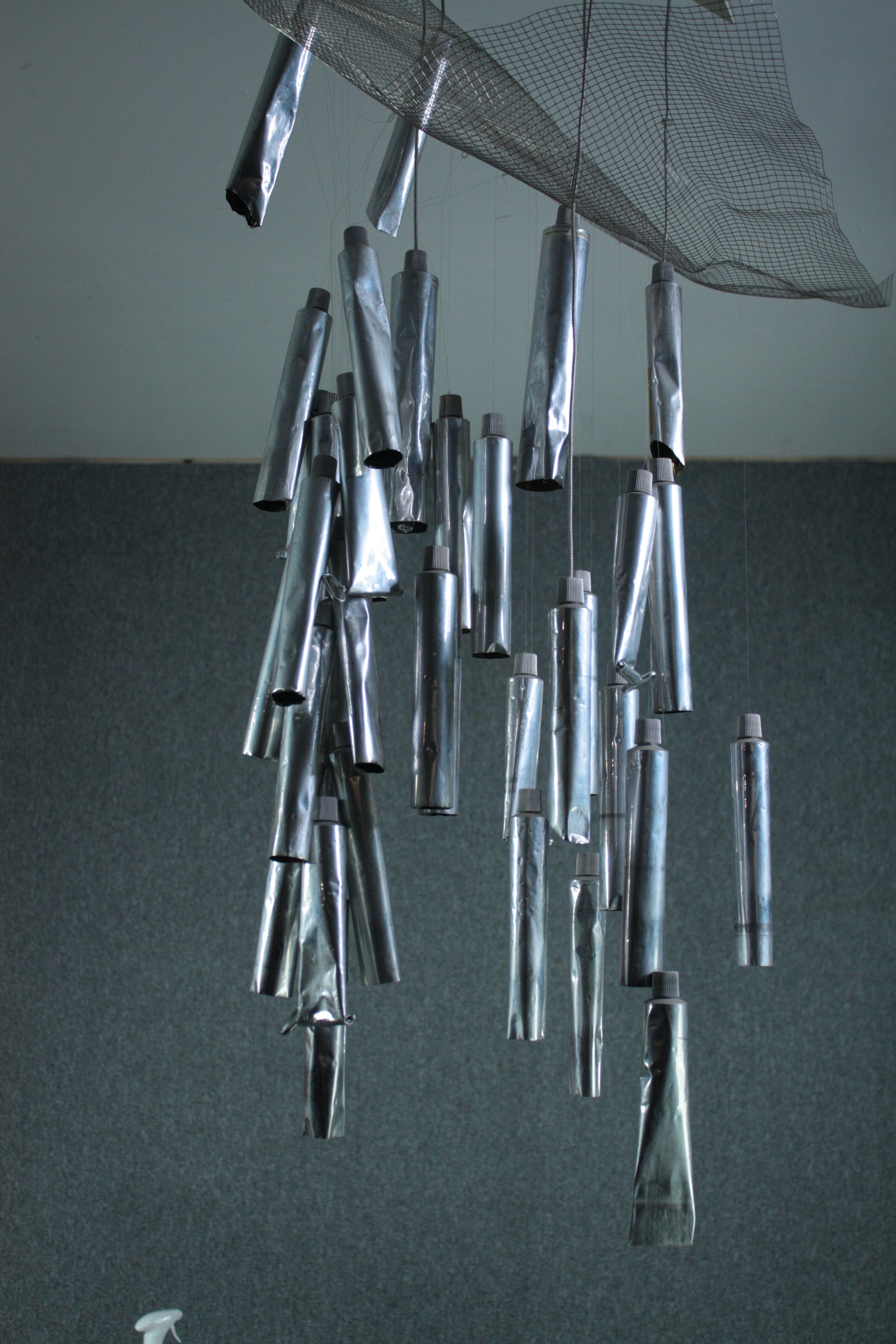 The Tu-Be 1, Ron Arad for Ingo Maurer. Hanging ceiling light. Multiple empty tubes of pallet paint