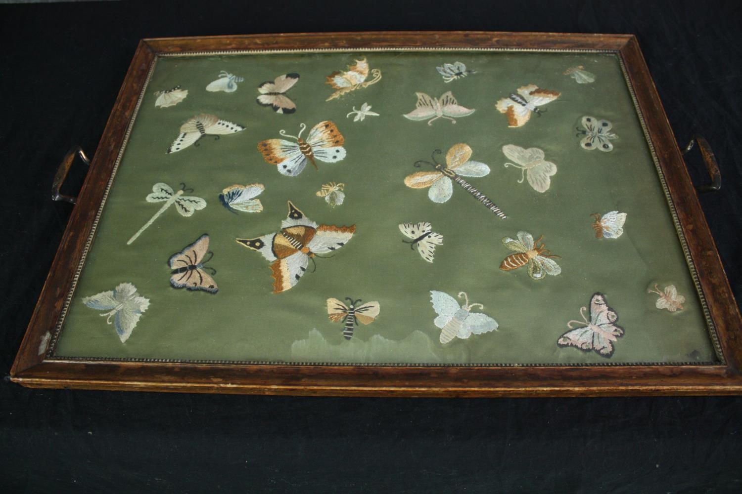 An embroidered tray featuring butterflies. Probably early twentieth century. L.63 W.43cm.