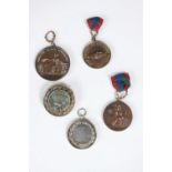 Four 19th century Napoleon III medals and a medal/brooch. Three bronze medals, one with shaking