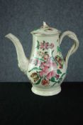 An 18th Century Creamware coffee pot and cover, circa 1780, with floral painted decoration and twist