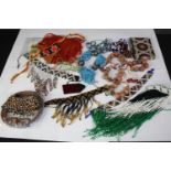 A collection of tribal beaded jewellery, including necklaces, belts and bracelets. With various