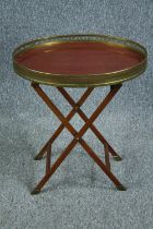 Tray table, folding, late 20th century with brass gallery and composite laminated top. H.58 W.50 D.