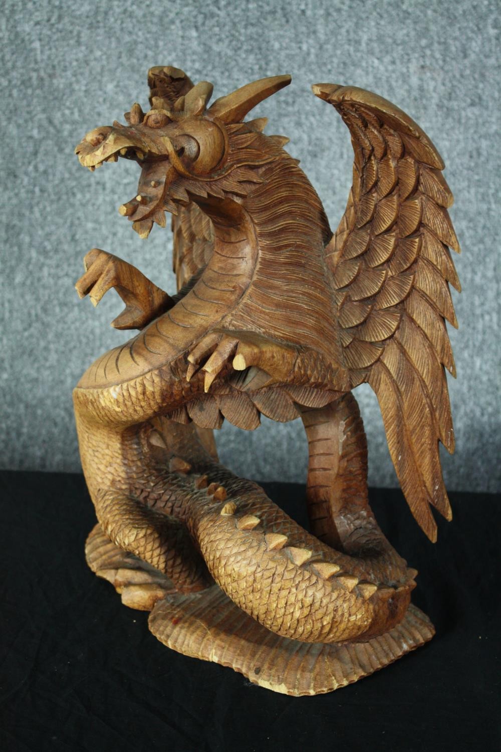 A carved Chinese dragon. Highly detailed with intricate scales and fangs. Twentieth century. H.44cm. - Image 3 of 4