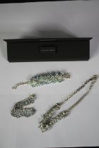 A collection of silver and blue topaz tassel style jewellery from Coloured Rocks, QVC. Each set with
