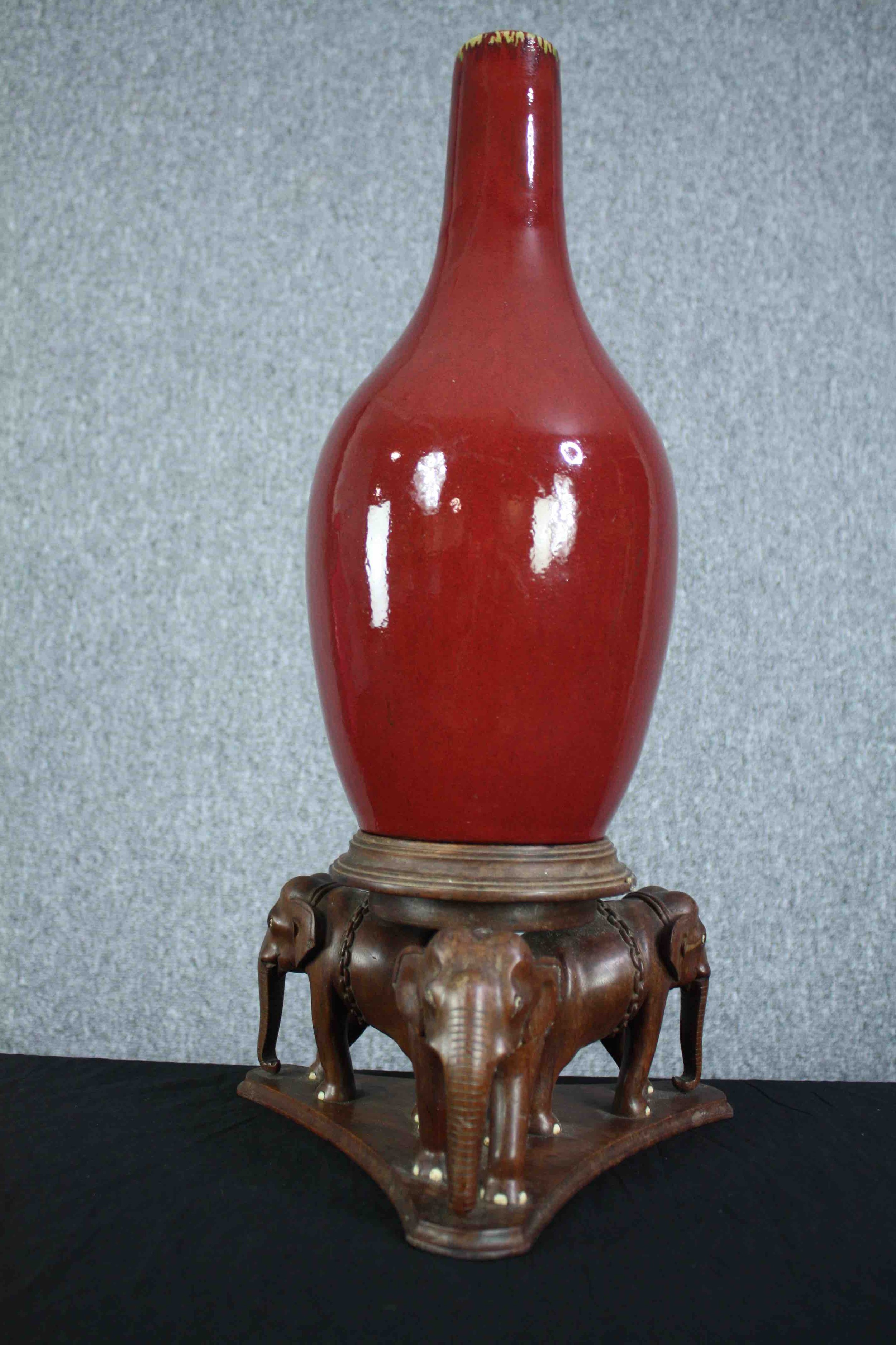 A Chinese flambe glaze bottle vase on a carved raised elephant stand. The stand is made up of - Image 4 of 6