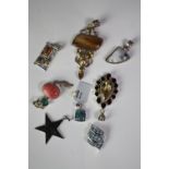 Eight silver and gemstone pedants of various designs. Gemstones include citrine, onyx, amber and