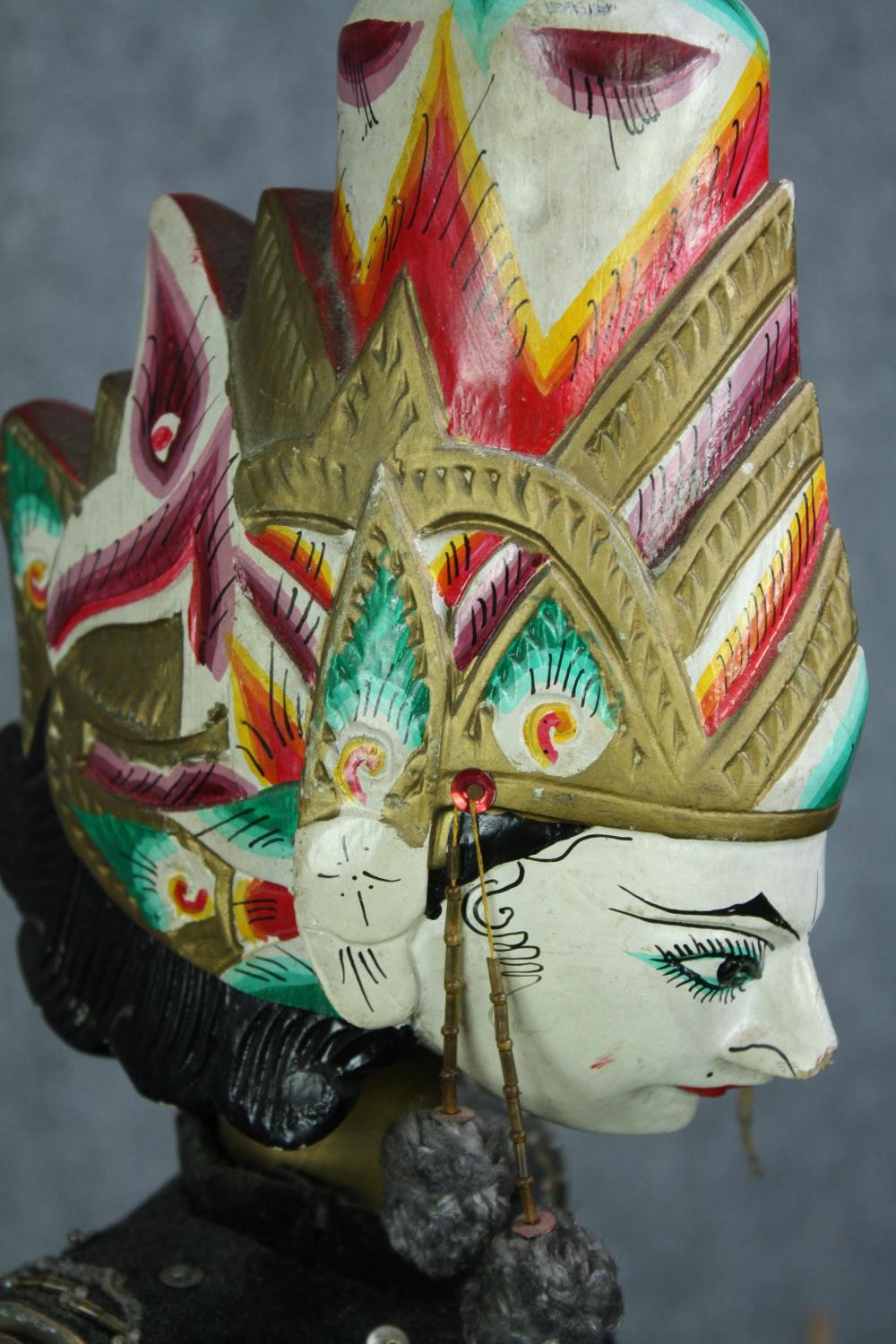 A vintage Indonesian carved and painted puppet. With a well decorated headdress and fabric dress. - Image 5 of 5