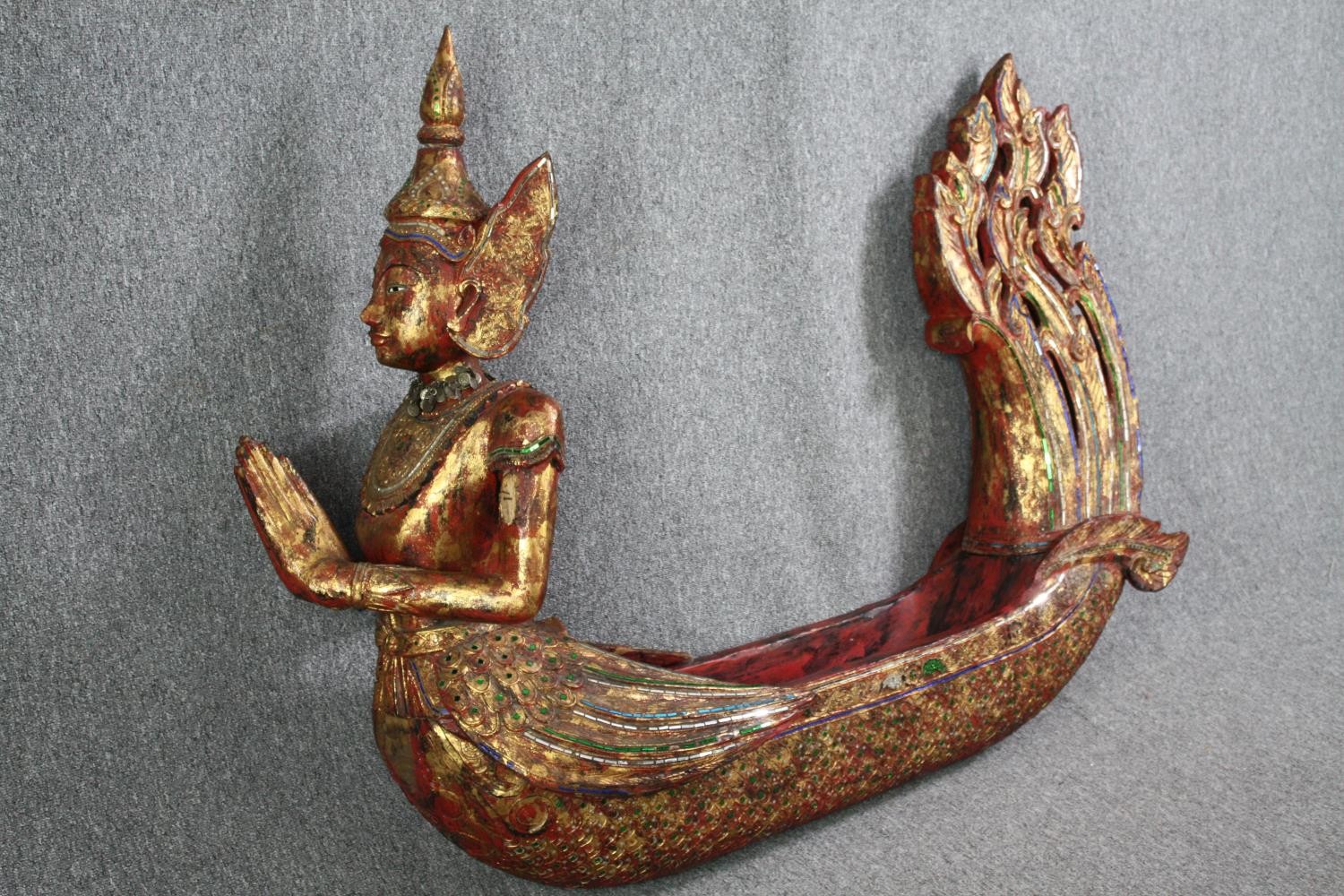 A large carved Buddha in a boat or canoe. Gilded and decorated with small mirror tiles. H.125 W. - Image 2 of 8