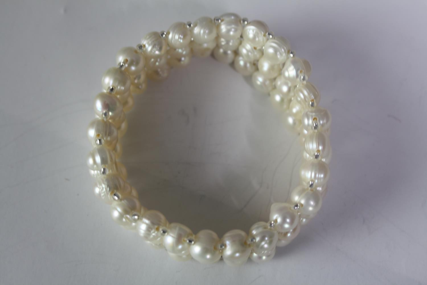 A collection of six cultured pearl elasticated bracelets of various designs, including a grey - Image 6 of 6