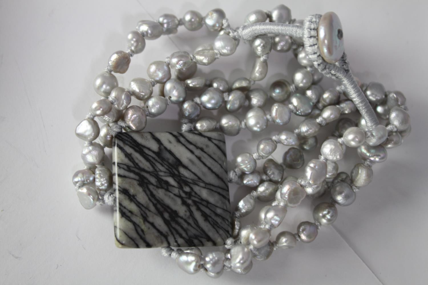 A collection of six cultured pearl elasticated bracelets of various designs, including a grey - Image 4 of 6