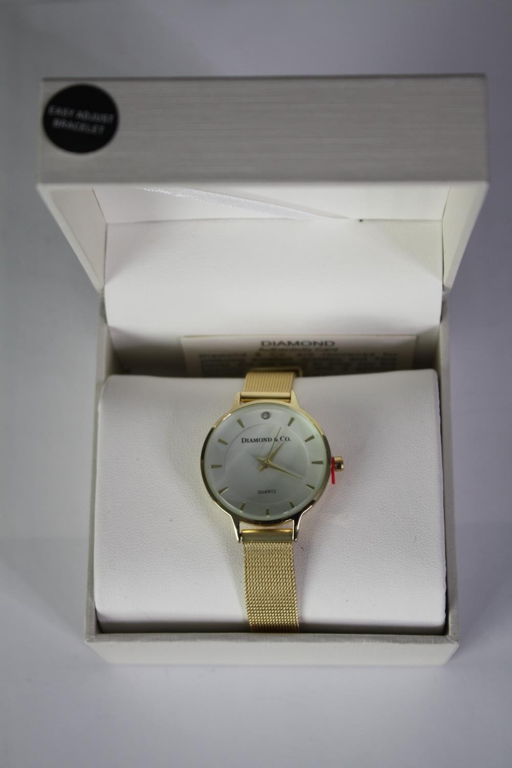 A boxed Diamond and Co ladies quartz watch with gold tone mesh strap and white dial. Box and papers. - Image 3 of 4