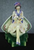 A Kevin Francis ceramic figure. Charlotte Rhead. Flat back. H.22cm.