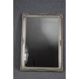 Wall mirror, silvered foliate framed. H.104 W.74cm.