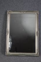 Wall mirror, silvered foliate framed. H.104 W.74cm.
