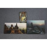 A collection of three prints on canvas featuring stone Buddhas. H.50 W.100cm. (largest)