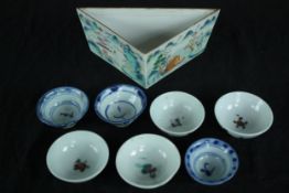 A 19th century Tangram hand painted Famille Rose Chinese triangular dish with seven tea bowls. H.7