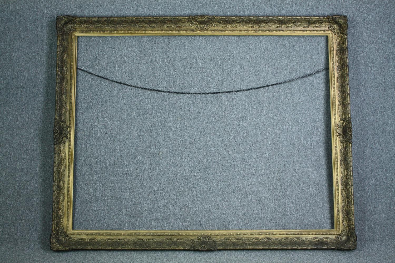 A very large giltwood and gesso frame. H.254 W.190 cm.