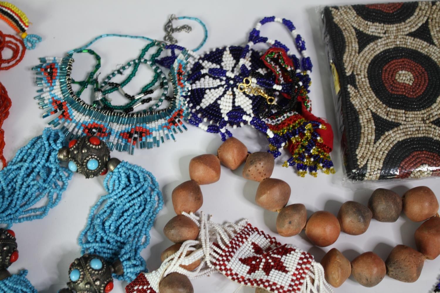 A collection of tribal beaded jewellery, including necklaces, belts and bracelets. With various - Image 5 of 8