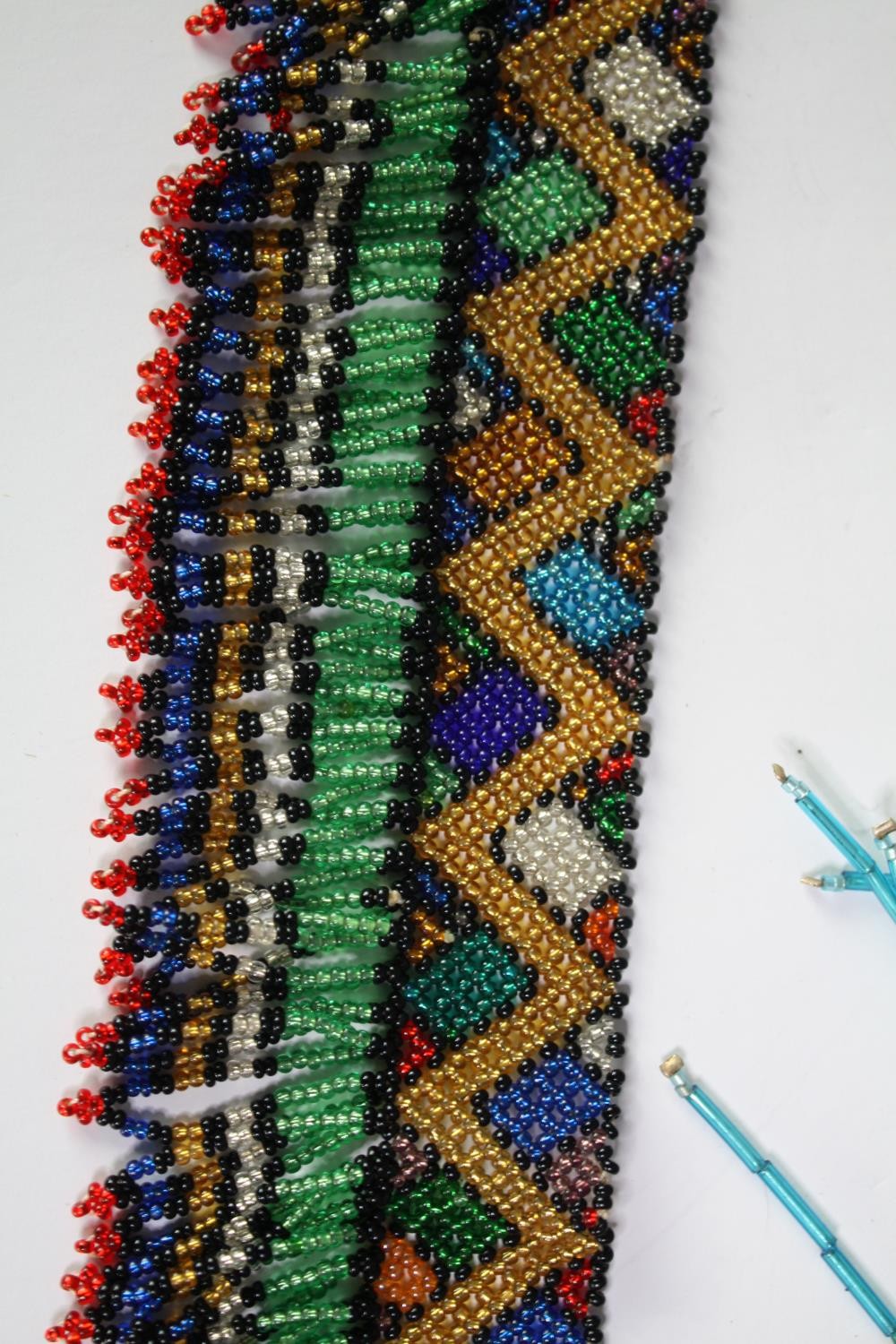 A collection of African tribal coloured seed bead jewellery, including a multi coloured zig zag - Image 2 of 9