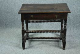 Side table, 18th century oak on stretchered bobbin turned supports. H.66 W.82 D.56cm.