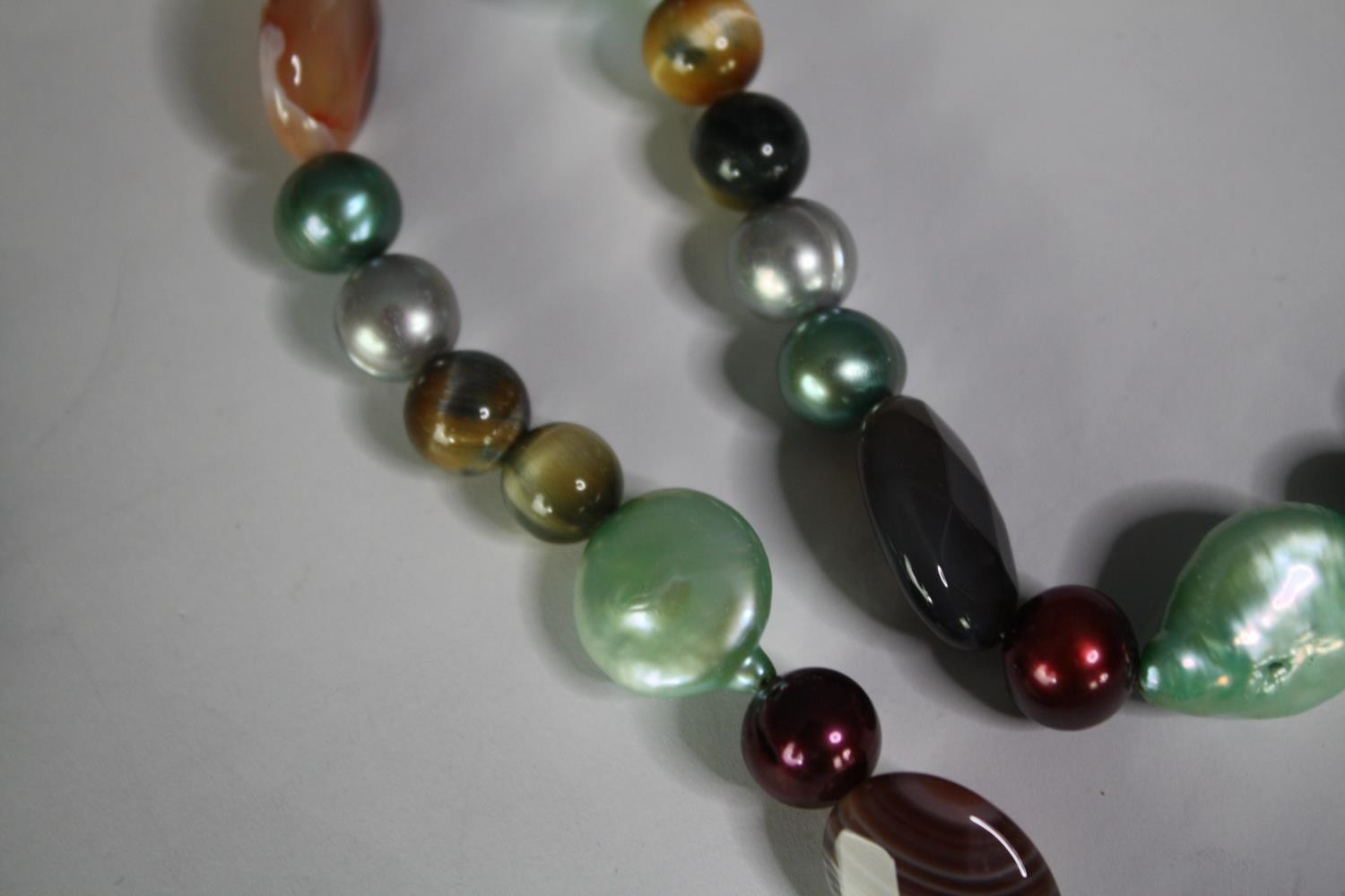 A collection of five fresh water cultured pearl necklaces of various designs, including a long - Image 6 of 6