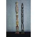 Two carved African Tribal figures with decorative headdress and well detailed faces. H.102 cm. (