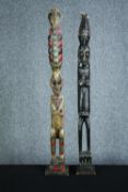 Two carved African Tribal figures with decorative headdress and well detailed faces. H.102 cm. (
