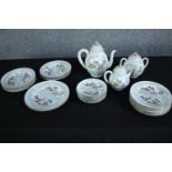 A late 20th century incomplete Japanese egg shell tea set made up of a teapot, jug, creamer and