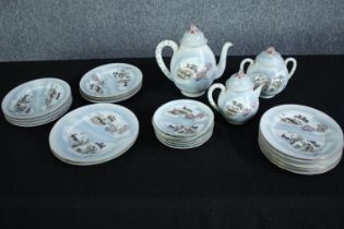 A late 20th century incomplete Japanese egg shell tea set made up of a teapot, jug, creamer and