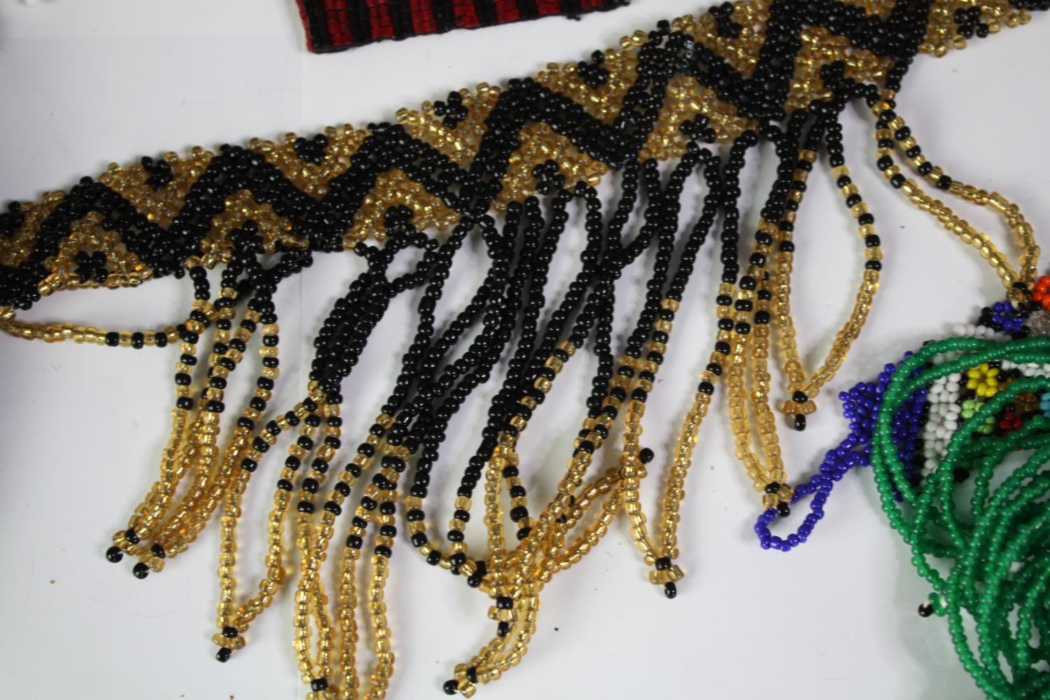 A collection of tribal beaded jewellery, including necklaces, belts and bracelets. With various - Image 7 of 8