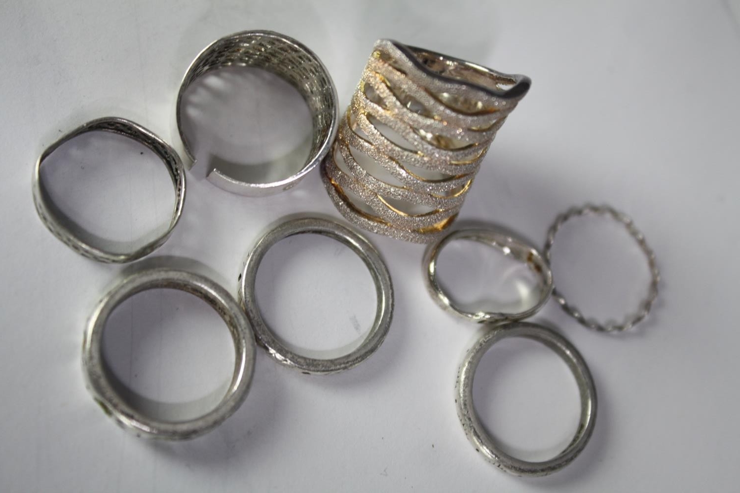 A collection of eleven contemporary silver rings, each with a different design and size. All stamped - Image 3 of 3
