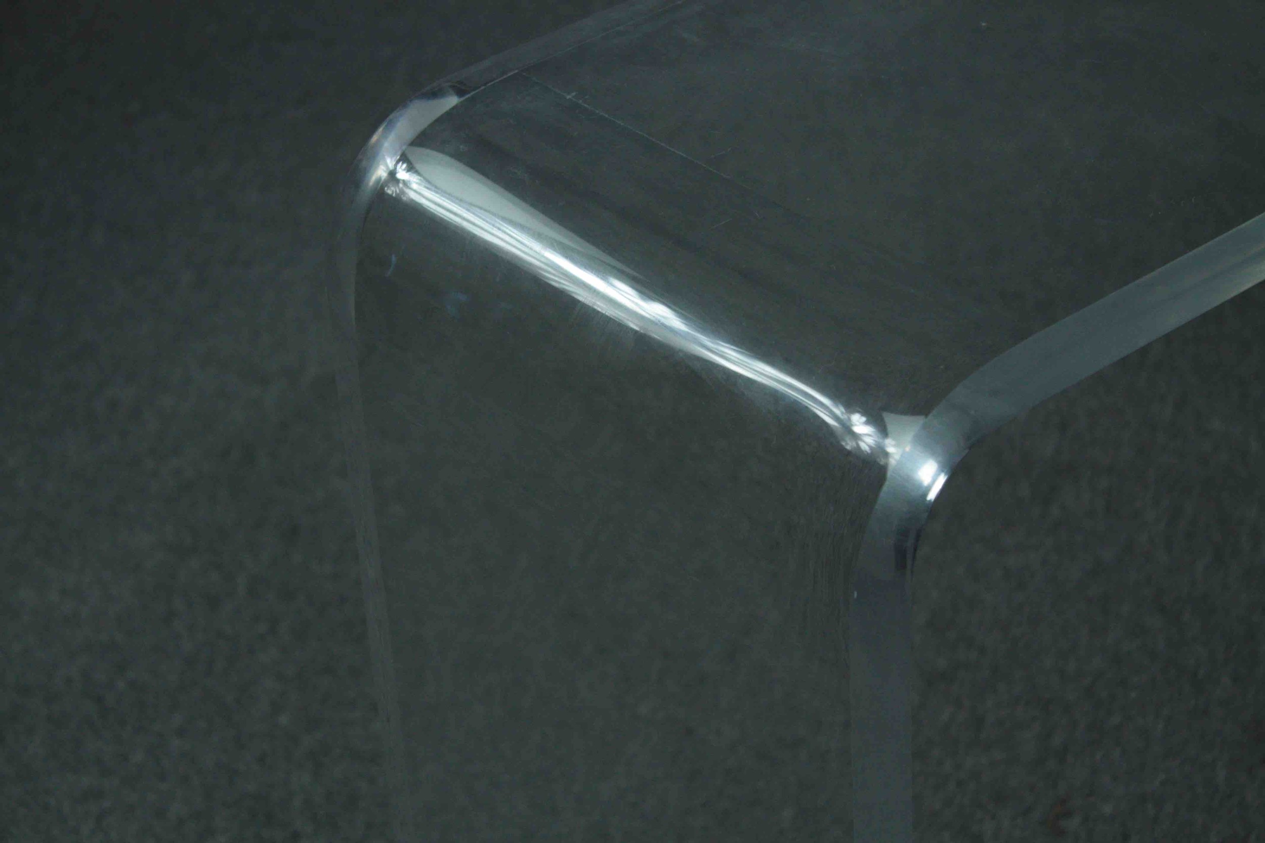 A contemporary lucite console table. H.73 W.108 D.32cm. - Image 5 of 5