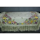 A Victorian French silk embroidered floral design bed throw with silk tassel edging. L.140 W.130cm.