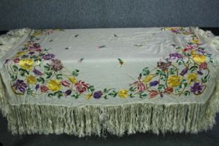 A Victorian French silk embroidered floral design bed throw with silk tassel edging. L.140 W.130cm.