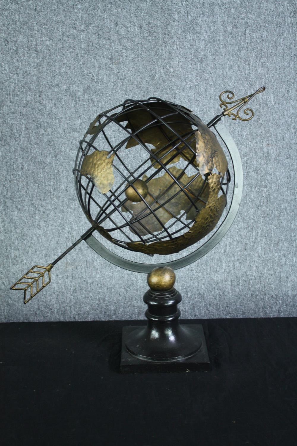 A vintage celestial metal armillary globe sphere, raised on turned ebonised socle. H.57. Dia.30 cm.