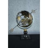 A vintage celestial metal armillary globe sphere, raised on turned ebonised socle. H.57. Dia.30 cm.