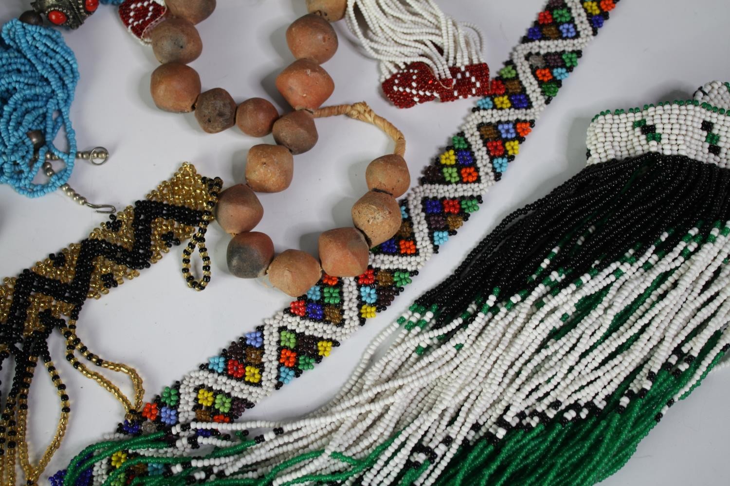 A collection of tribal beaded jewellery, including necklaces, belts and bracelets. With various - Image 2 of 8