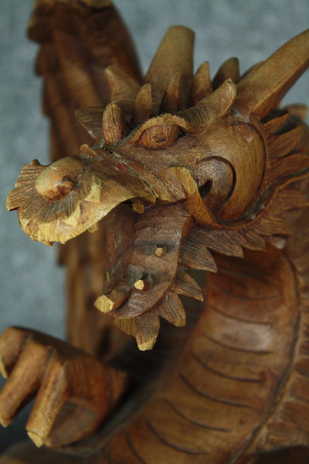 A carved Chinese dragon. Highly detailed with intricate scales and fangs. Twentieth century. H.44cm. - Image 4 of 4