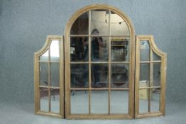 A floor standing window pane triptych mirror in painted gilt frame. H.150 W.180cm.
