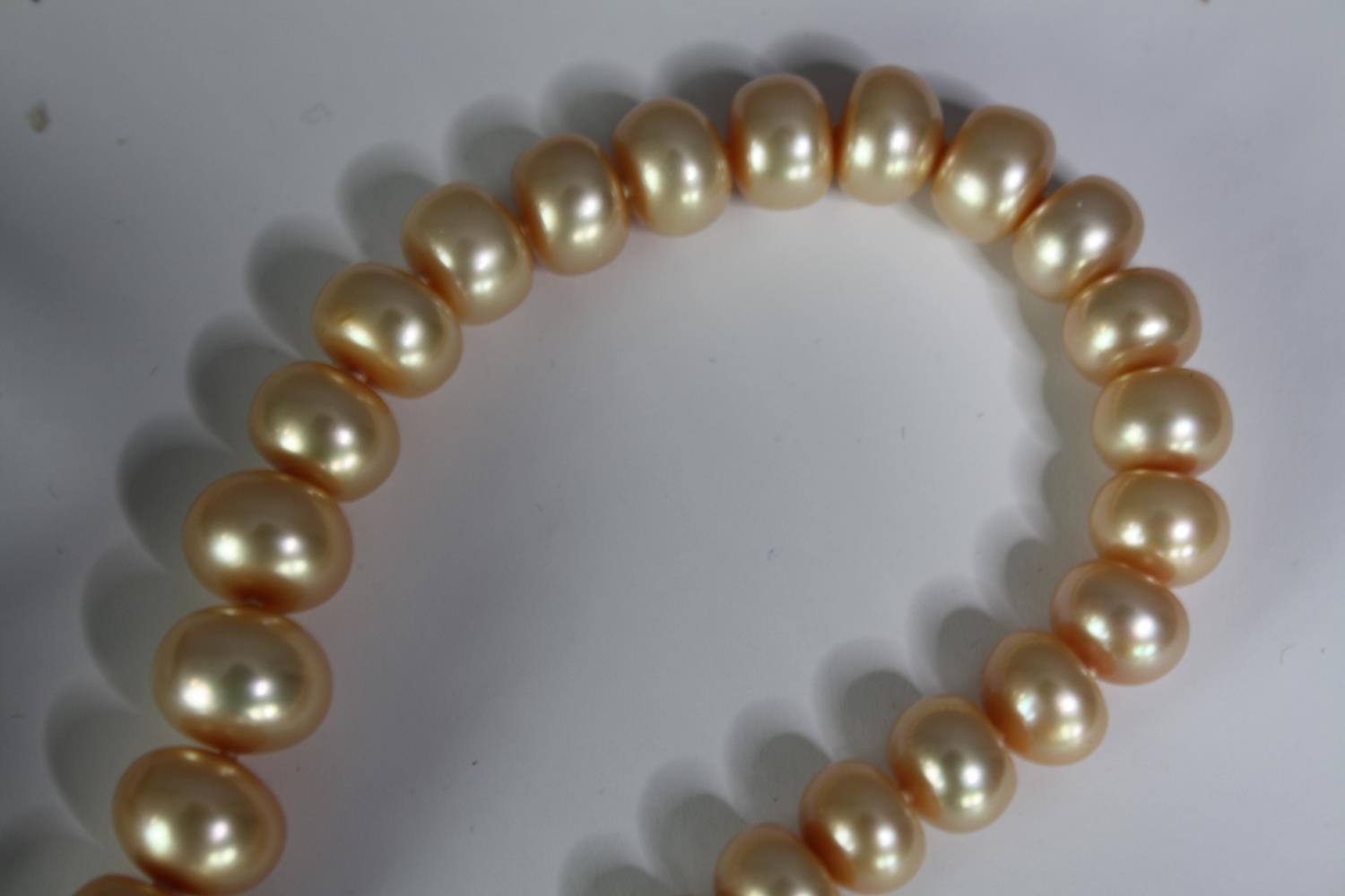 A collection of six mixed cultured pearl necklaces, including a dyed blue circular fresh water pearl - Image 7 of 7