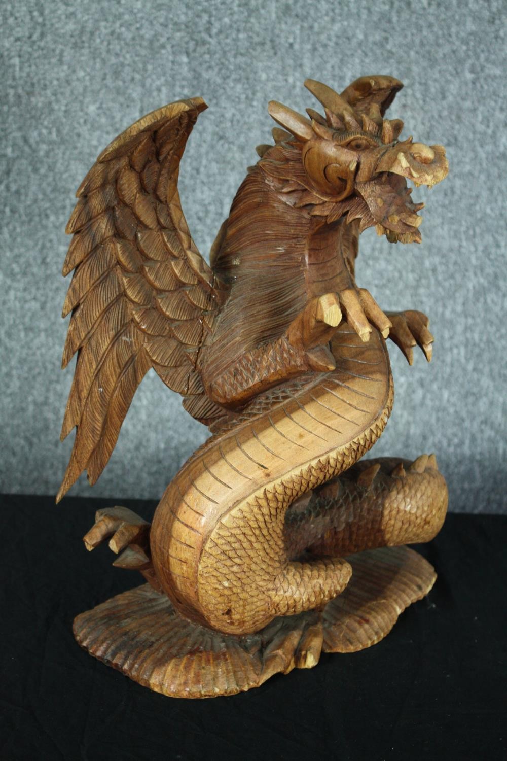 A carved Chinese dragon. Highly detailed with intricate scales and fangs. Twentieth century. H.44cm. - Image 2 of 4