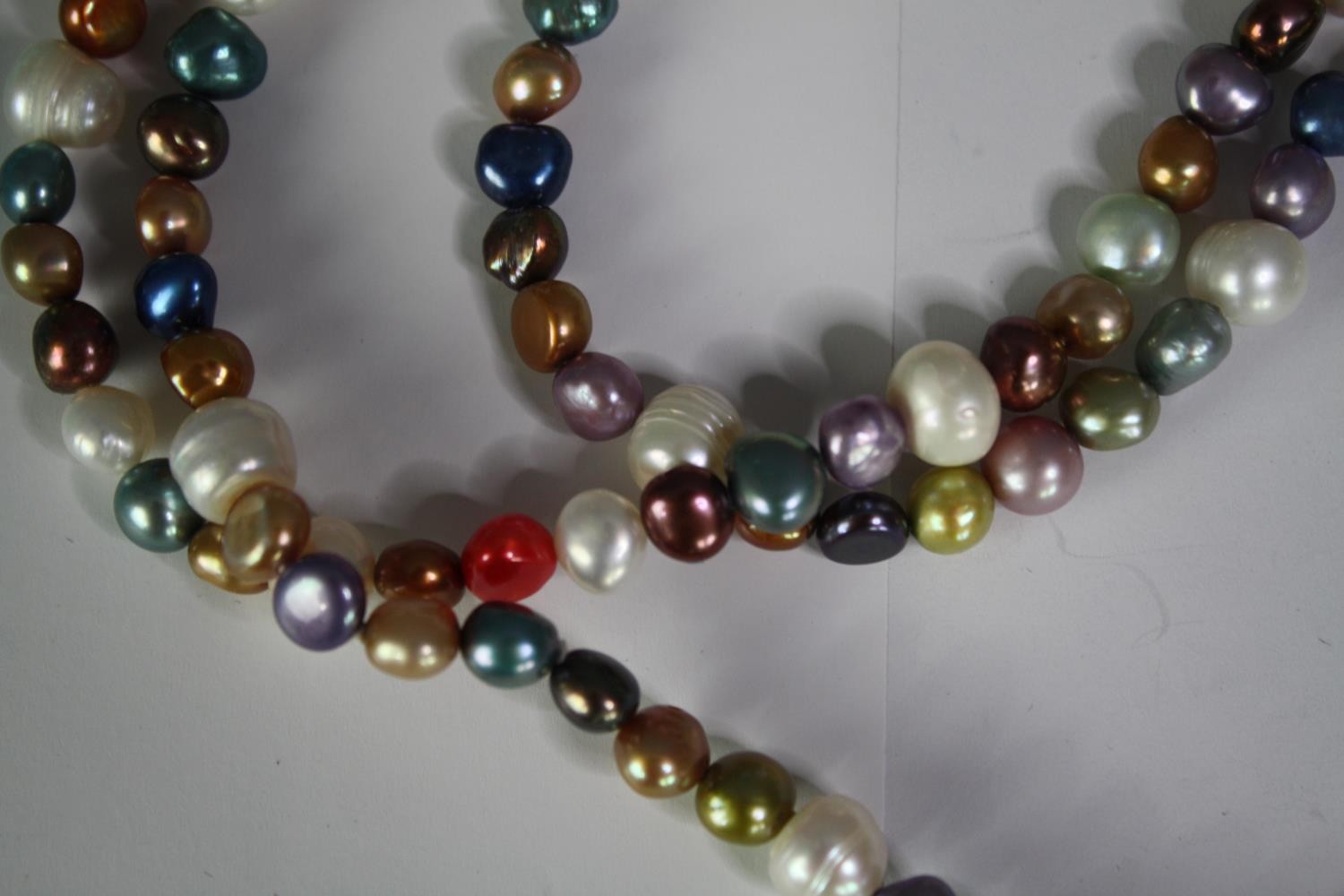 A collection of five fresh water cultured pearl necklaces of various designs, including a long - Image 5 of 6