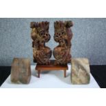 A pair of marble bookends and a pair of carved Chinese dragons. The dragons have been lacquered