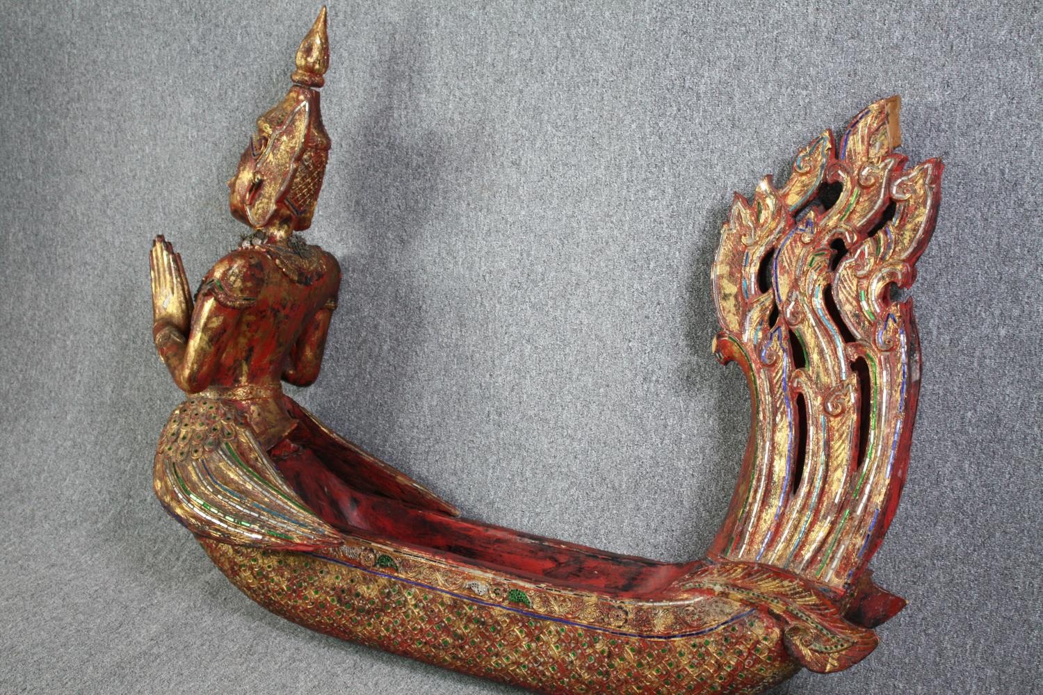 A large carved Buddha in a boat or canoe. Gilded and decorated with small mirror tiles. H.125 W. - Image 3 of 8