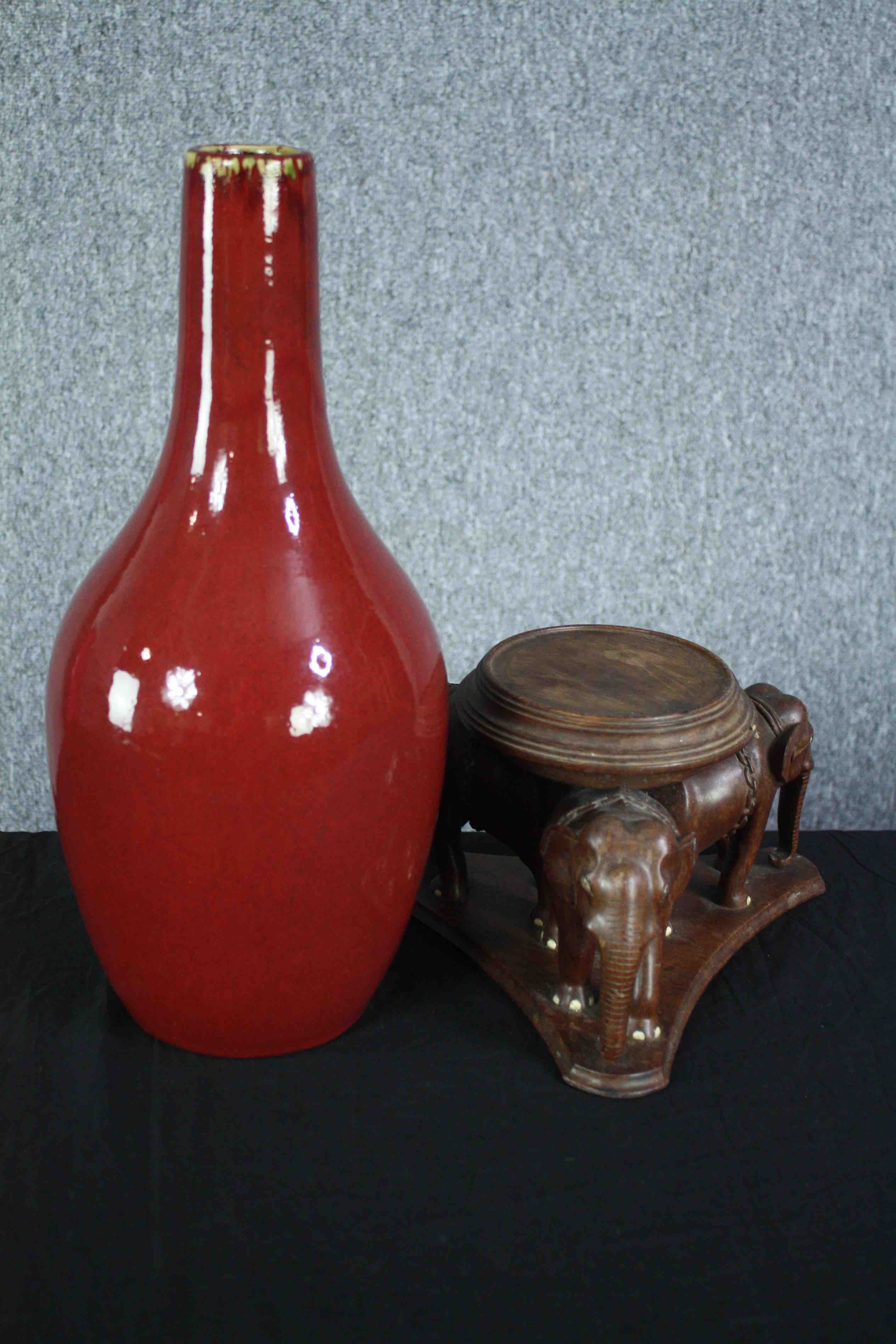 A Chinese flambe glaze bottle vase on a carved raised elephant stand. The stand is made up of - Image 5 of 6