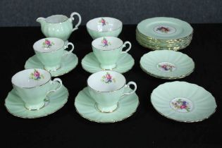 Grosvenor China. An incomplete tea set. Made up of five cups, six saucers, a creamer and seven