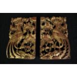 A pair of carved decorative panels. Probably Chinese. Twentieth century. Finished in gilt. H.32 W.