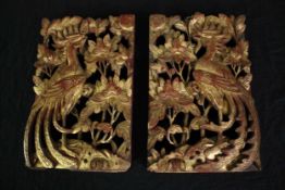 A pair of carved decorative panels. Probably Chinese. Twentieth century. Finished in gilt. H.32 W.